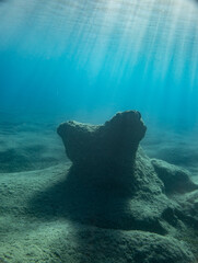 Reflection of sunlight on undersea stones