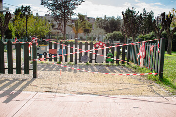 Fototapeta na wymiar Children's playground, toys outdoor on a children play area closed in Peristeri, Greece