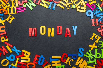 Monday word made of bright colored letters on black background