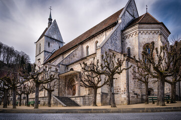 Fototapeta na wymiar Church and its cloister in the small old town of Saint-Ursanne