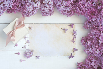 Spring branch lilac flowers on  wooden table