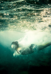 Boy swimming underwater