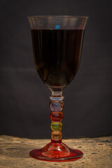 Paris, France - 11 11 2020: A glass of red wine with a colored stem