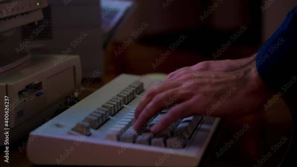 Poster close up of male hands typing on the old computer. media. man using old fashioned keyboard and typin