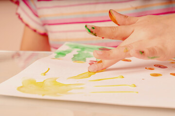 Obraz na płótnie Canvas Art and fun leisure time concept. Beautiful young girl great artist painting picture with hands.