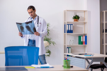 Young male doctor radiologist working in the clinic