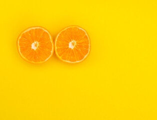 Oranges slices on a orange background