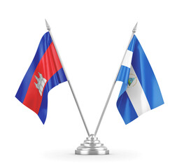 Nicaragua and Cambodia table flags isolated on white 3D rendering 