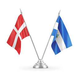 Nicaragua and Denmark table flags isolated on white 3D rendering