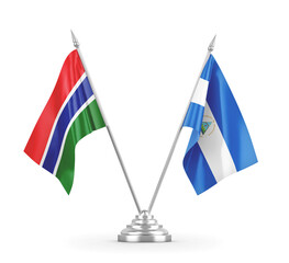 Nicaragua and Gambia table flags isolated on white 3D rendering