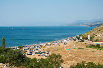 Camping by the sea in Crimea on a summer day
