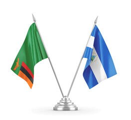 Nicaragua and Zambia table flags isolated on white 3D rendering