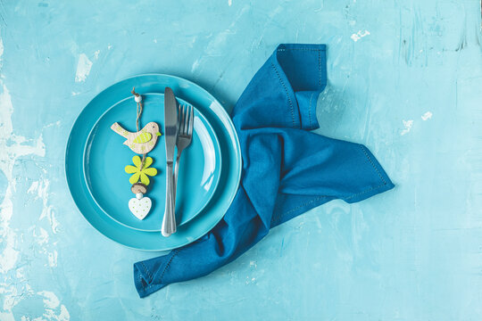 Easter simple table setting. Light blue colored table setting.