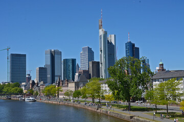 Fototapeta na wymiar Panoramic view on Frankfurts Skyline, seen from a bridge over the river Main, Frankfurt, Germany