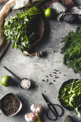 Bunch of fresh homegrown organic dill, spinach, arugula and spring onion on rustic wooden table