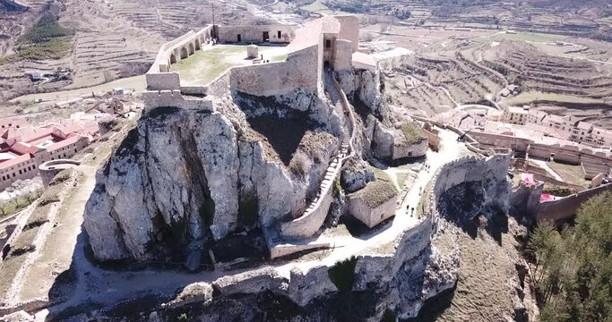 Aerial view of Castillo de Morella - multilevel castle on rock top in ancient Spanish walled city Morella