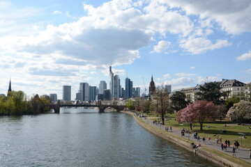 Fototapeta na wymiar View on Frankfurts Skyline, seen from a bridge over the river Main