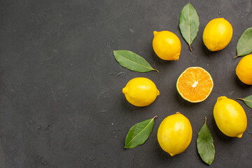 top view fresh sour lemons lined on dark floor citrus lime yellow fruit