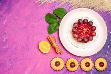 top view little cookies with cake on pink background sweet biscuit cake desserts