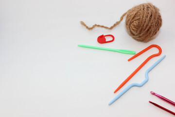 Knitting supplies and brown yarn