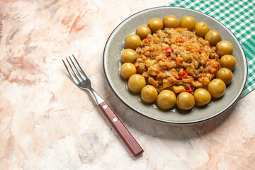 bottom view roasted eggplant salad on plate fork on nude background free space