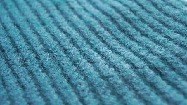 Rows of Woolen Fiber Indigo Sweaters. Blue geometric parallel lines. Macro. Dolly Shot