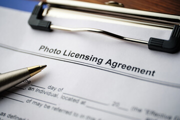 Legal document Photo Licensing Agreement on paper close up.