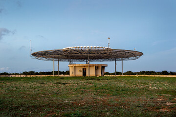 A VOR VHF omnidirectional range ground station with DME for the use of pilots during flights at...