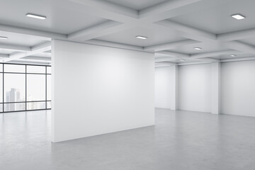Bright gallery interior with city view, daylight and blank wall.