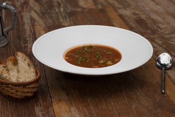 Hearty beef goulash soup served with toasted bread