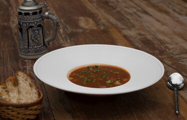 Hearty beef goulash soup served with toasted bread