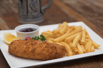 Pork Cordon Bleu served with French fries and Cranberrry Sauce