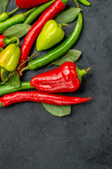 top view different fresh peppers on dark background food diet salad spice