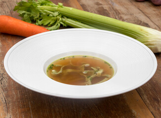 Beef consommé with pancake julienne