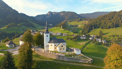DRONE: Aerial view of the idyllic Slovenian countryside on sunny autumn evening.