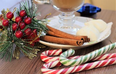 christmas table setting with candy and cup of coffee