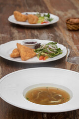 Beef consommé with pancake julienne