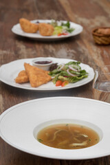 Beef consommé with pancake julienne