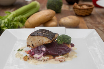 Pan-fried black cod on sautéed beetroot and potatoes with horseradish cream 