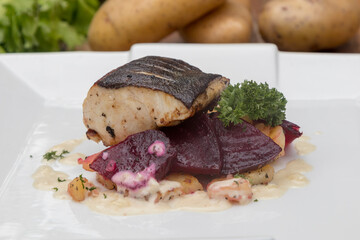 Pan-fried black cod on sautéed beetroot and potatoes with horseradish cream 