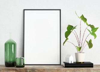 Mock up poster frame on white plaster wall with plant in a pot, house model and glass vases on wooden shelf; portrait orientation; stylish frame mock up background; 3d rendering, 3d illustration
