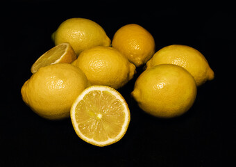 seven lemons on a black background