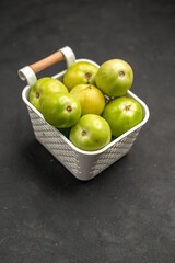 front view green tomatoes inside basket on dark background fresh photo ripe colors food