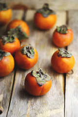 Persimmon on a wooden surface.