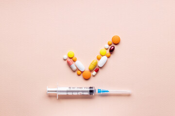medical pills check mark symbol isolated on pink background. medicine approve sign concept. outer...