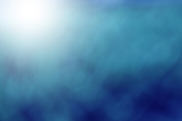 Blue light leaves blurred and blur natural abstract. Effect sunlight  soft bright shiny style  bokeh circle yellow and orange blurry morning . For wallpaper backdrop and background.
