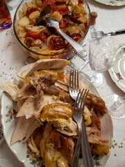 serving a capon with vegetables at the table