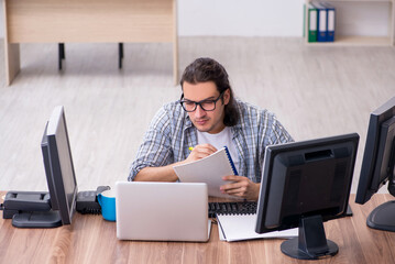 Young male it specialist working in the office