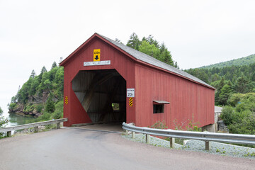 NEW  BRUNSWICK, CANADA - August 5, 2017: Point Wolfe covered  bridge in Fundy National Park, New Brunswick, Canada. Built in 1992, this covered bridge is 29 m (94 ft.) in length. 