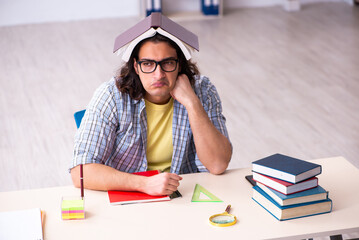 Young male student preparing for exams